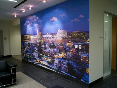 Large-format wall mural installation in commercial interior space